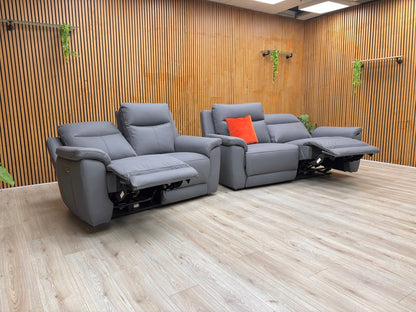 Lifestyle view of the 3-seater Bobby sofa, showcasing the rich navy leather grain and the plush, supportive armrests.