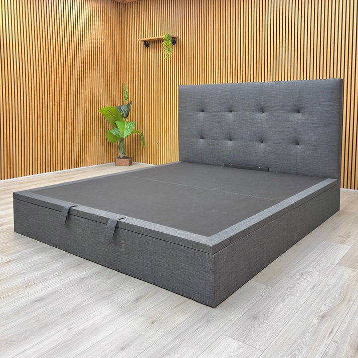 Lifestyle view of the Hadley bed frame in its open position, showcasing the large storage compartment and the sturdy sprung slatted base.