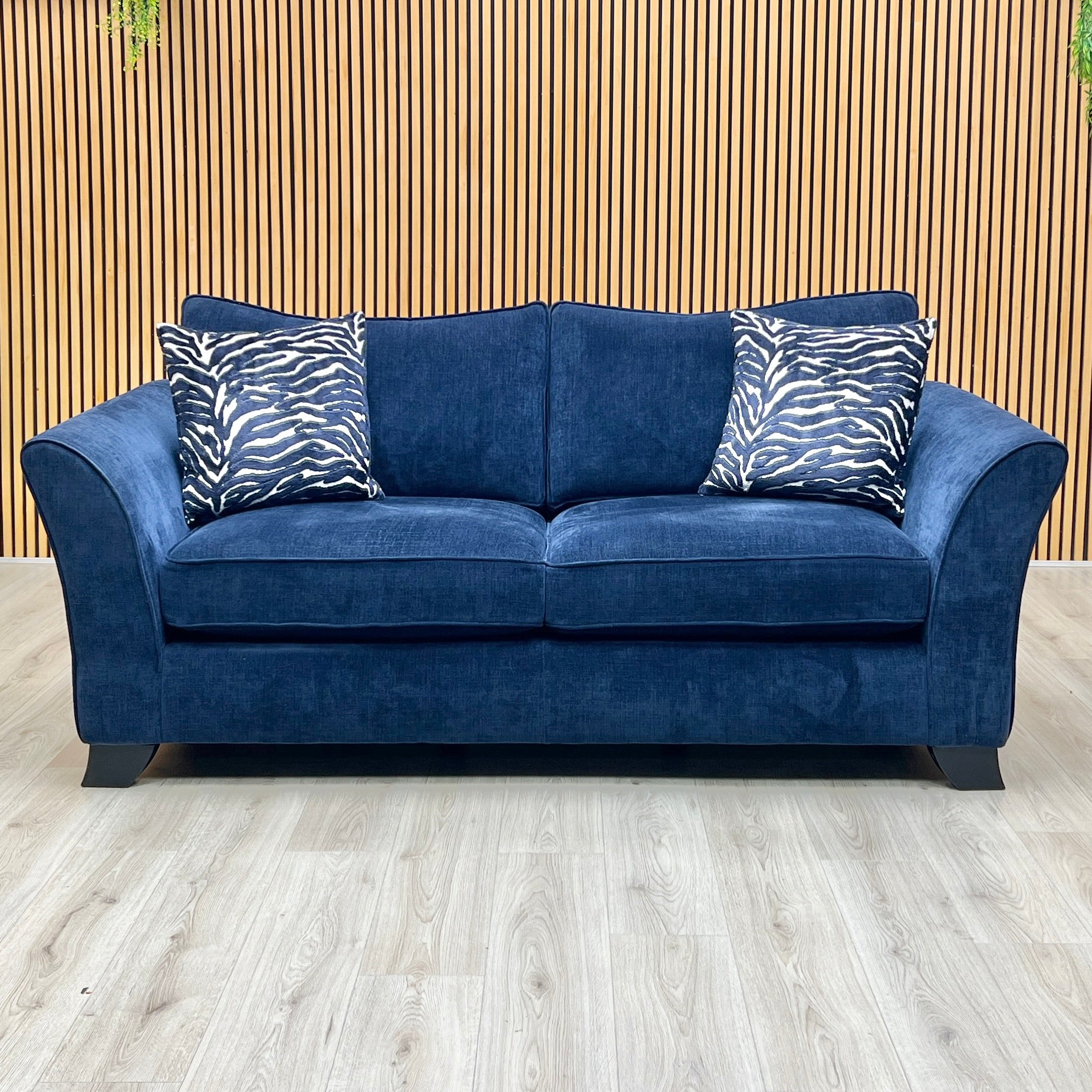 Front-facing wide studio view of the complete Sasha Zara Navy Blue sofa set arranged together, highlighting the classic back design, deep plush cushions, and uniform tailored lines across both matching units.