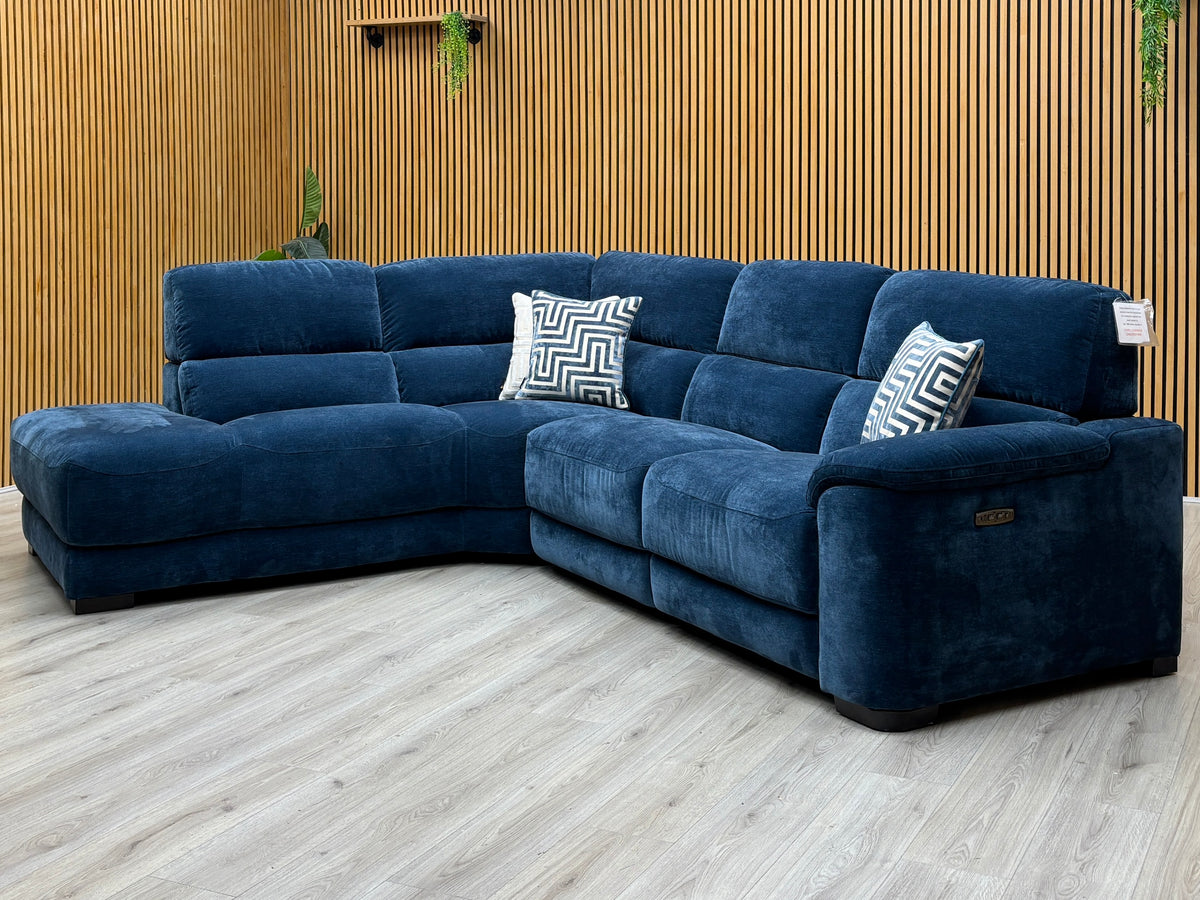 Nova steel blue fabric left hand facing chaise end sofa against a slatted wooden wall