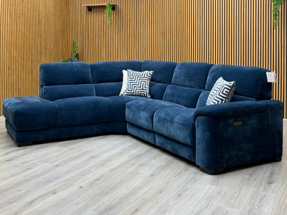 Nova steel blue fabric left hand facing chaise end sofa against a slatted wooden wall