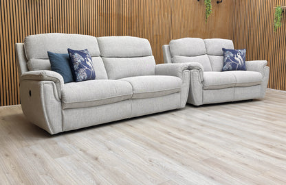 Lifestyle View for the Ashton power recliner set, highlighting the durable Bariba Grey fabric, integrated power reclining mechanisms, and stylish chrome accents.