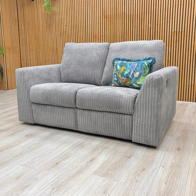 Lifestyle view of the Heydon 2-seater sofa, highlighting the split backrest cushioning, plush armrests, and clean modern lines.