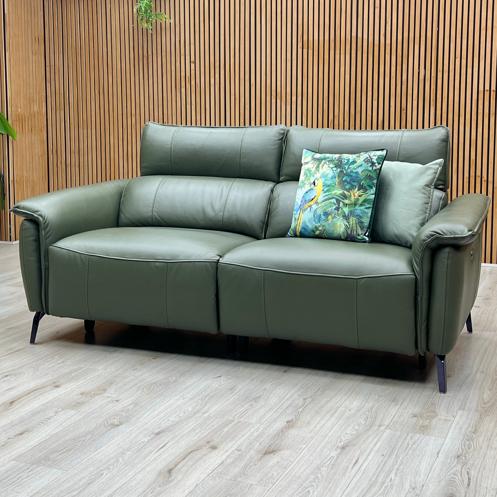 Front-facing wide studio view of the Jude 3-seater power recliner, showcasing the deep segmented ergonomic back cushions, integrated power headrests, and precise symmetrical leather tailoring.