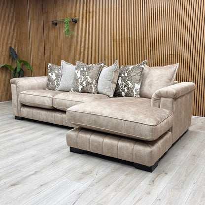Liferstyle View DFS ‘Dolcie’ 3-seat chaise sofa, right hand facing orientation, beautifully upholstered in luxurious caramel combination Dolcie velvet with a relaxed, casual pillow back configuration.