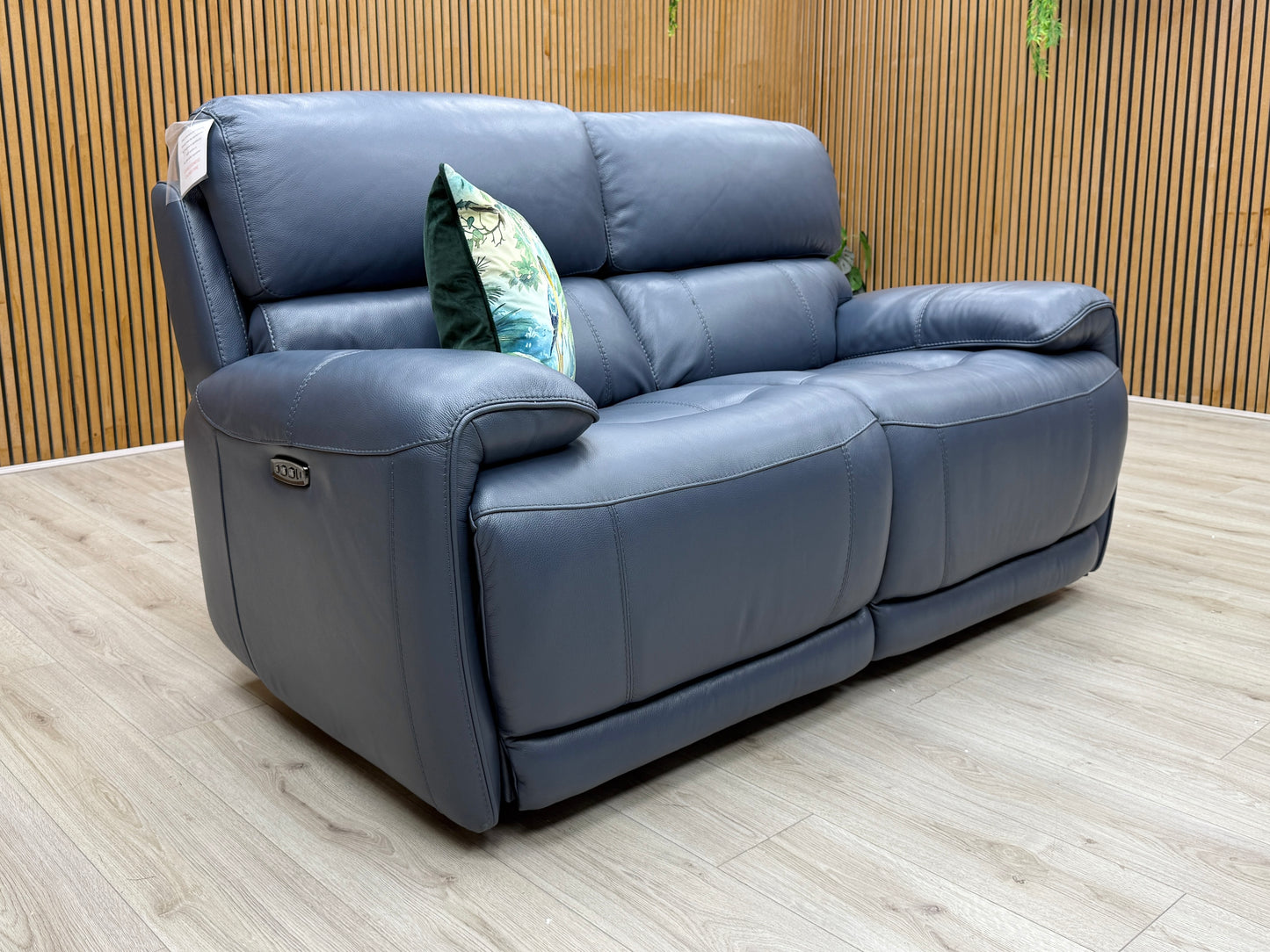 Side profile of the 2-seater sofa, showcasing the deep cushioning and the sleek silhouette of the power rocking and reclining frame.