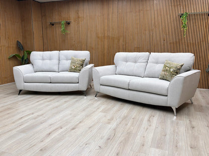 Lifestyle View DFS ‘Dawson’ 2-piece lounge suite, featuring a matching 3-seater and 2-seater sofa set upholstered in a durable silver plain woven fabric.