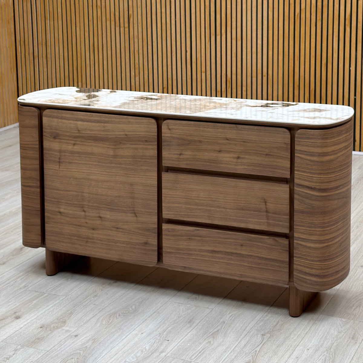 Mekong marble effect ceramic top 1 door 3 drawer sideboard against a slatted wooden wall