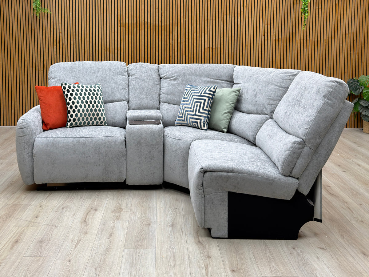 Darren light grey fabric chaise sofa against a slatted wooden wall on a light oak floor