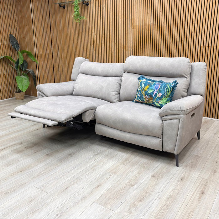 Lifestyle view of the Panache sofa in Dexter Stone fabric, showcasing the footrests fully extended in a reclined position for premium comfort.