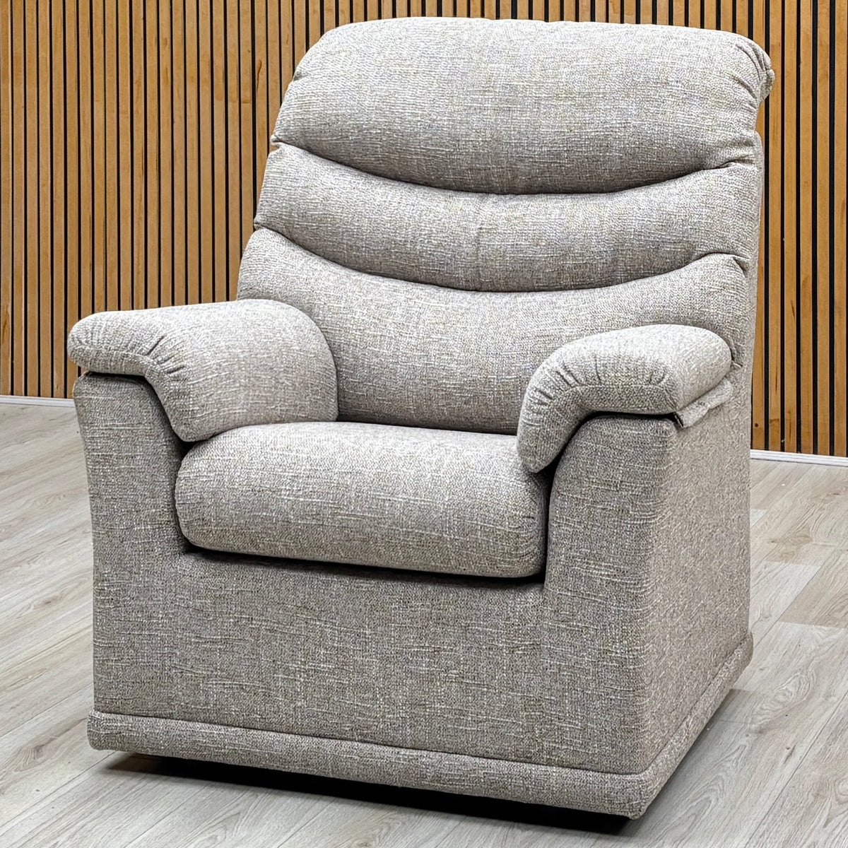 G Plan Malvern oatmeal woven fabric chair photographed against a slatted wooden wall on a pale floor