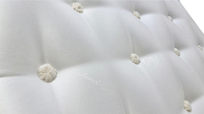 Close-up view of the top surface of the Oakley Ortho mattress, highlighting the quilted or tufted pattern and breathable fabric.