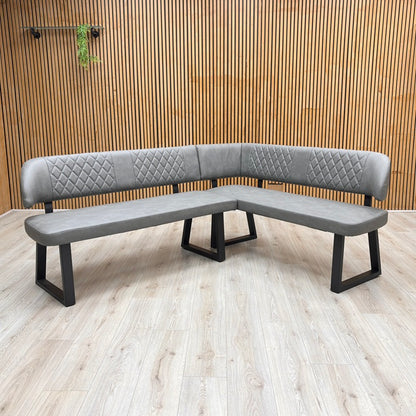 Lifestyle view of the Venus corner bench arrangement in a stylized modern dining room setting.
