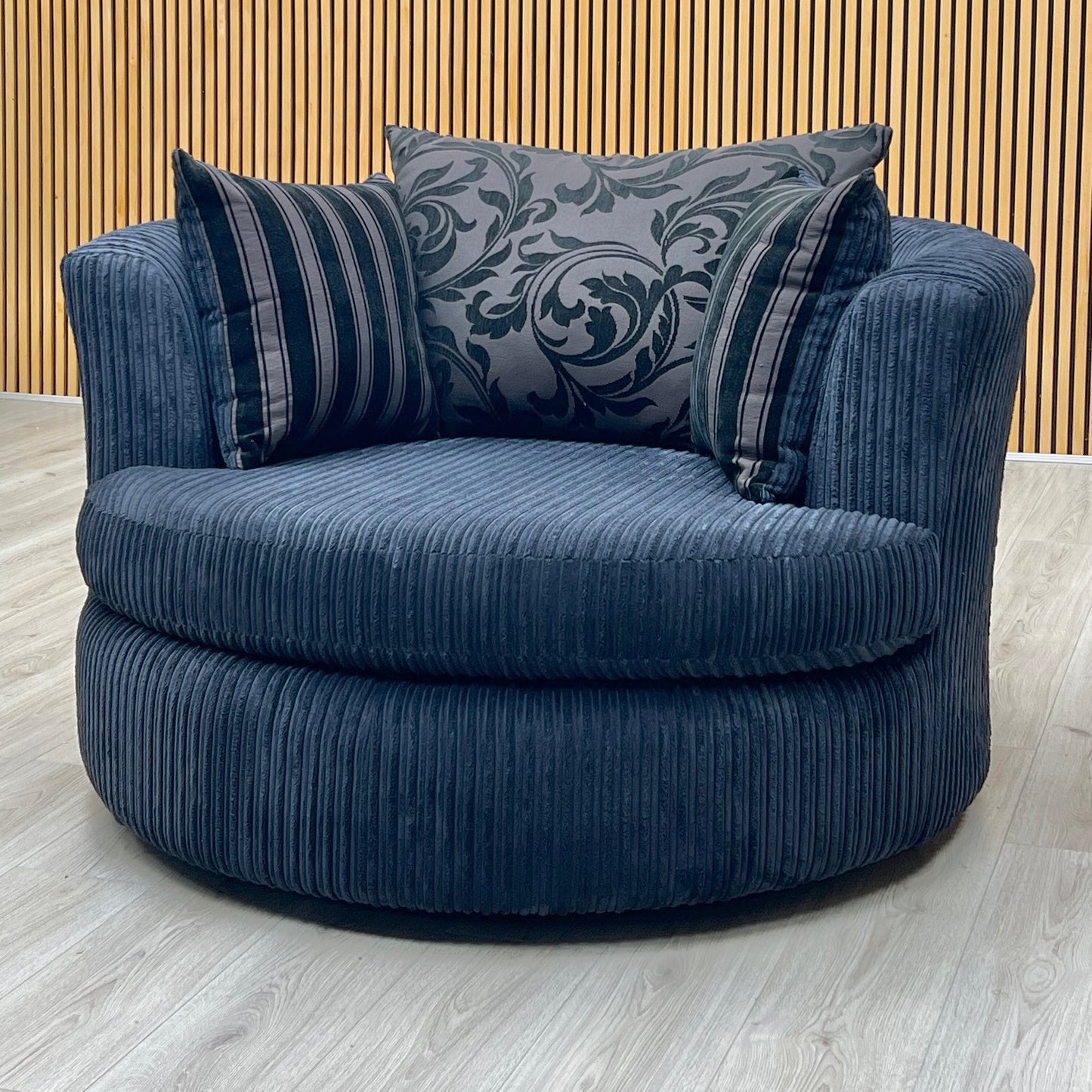‘Celine' Black Celine Cord Fabric Large Swivel Chair DFS