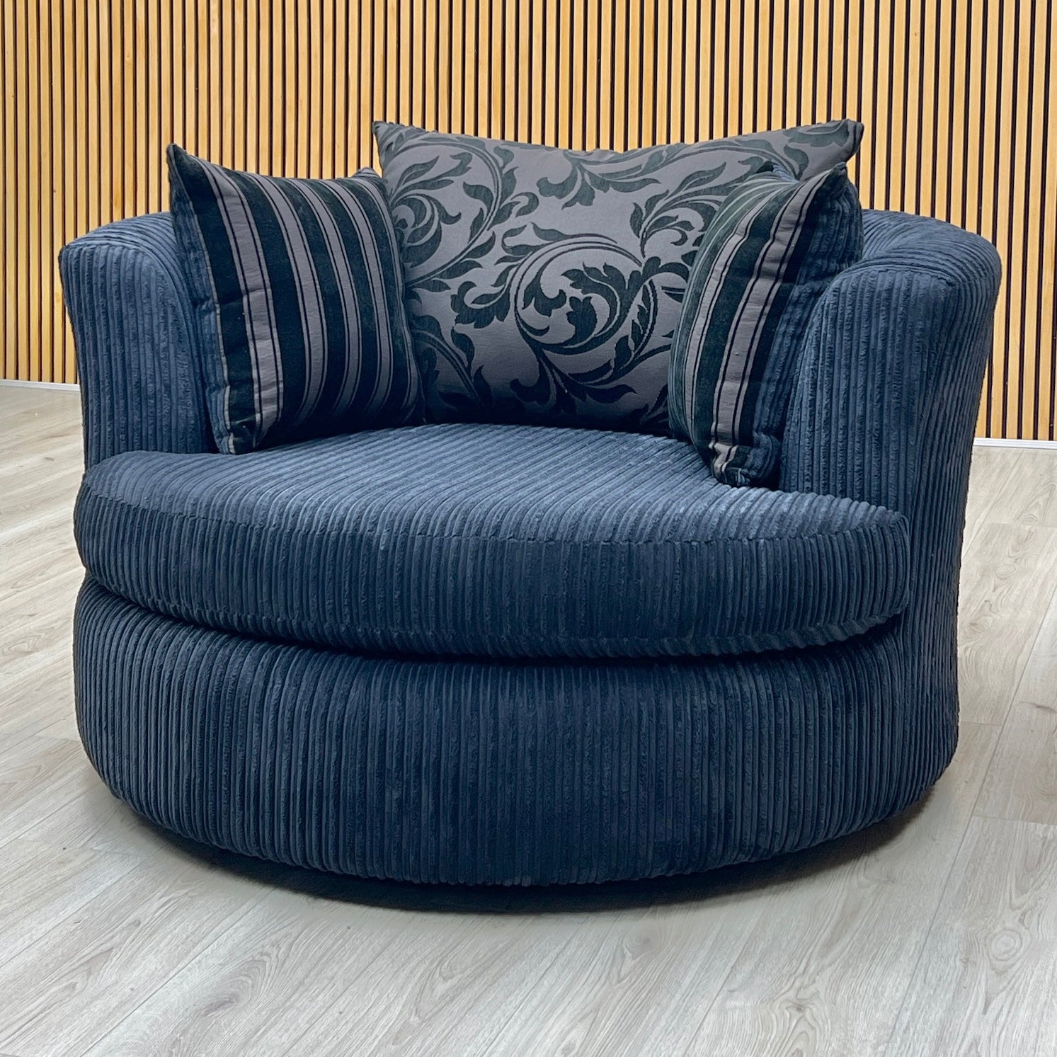 ‘Celine' Black Celine Cord Fabric Large Swivel Chair DFS