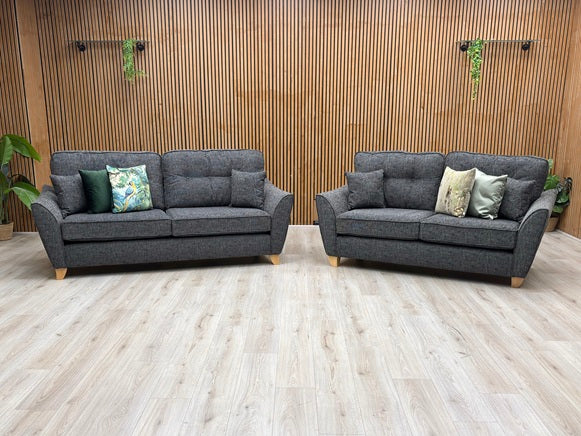 Living room view of the Halstow 3-seater and 2-seater sofas, displaying their welcoming deep-seated design, comfortably padded track armrests, and elegant contemporary silhouette.