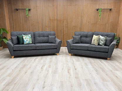 Living room view of the Halstow 3-seater and 2-seater sofas, displaying their welcoming deep-seated design, comfortably padded track armrests, and elegant contemporary silhouette.