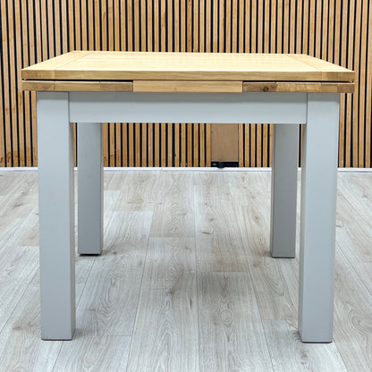 ‘Hamilton’ Solid American Oak Draw Leaf Extending Dining Table with Charcoal Grey Fabric Dining Chairs - Set of 4 Furniture Village