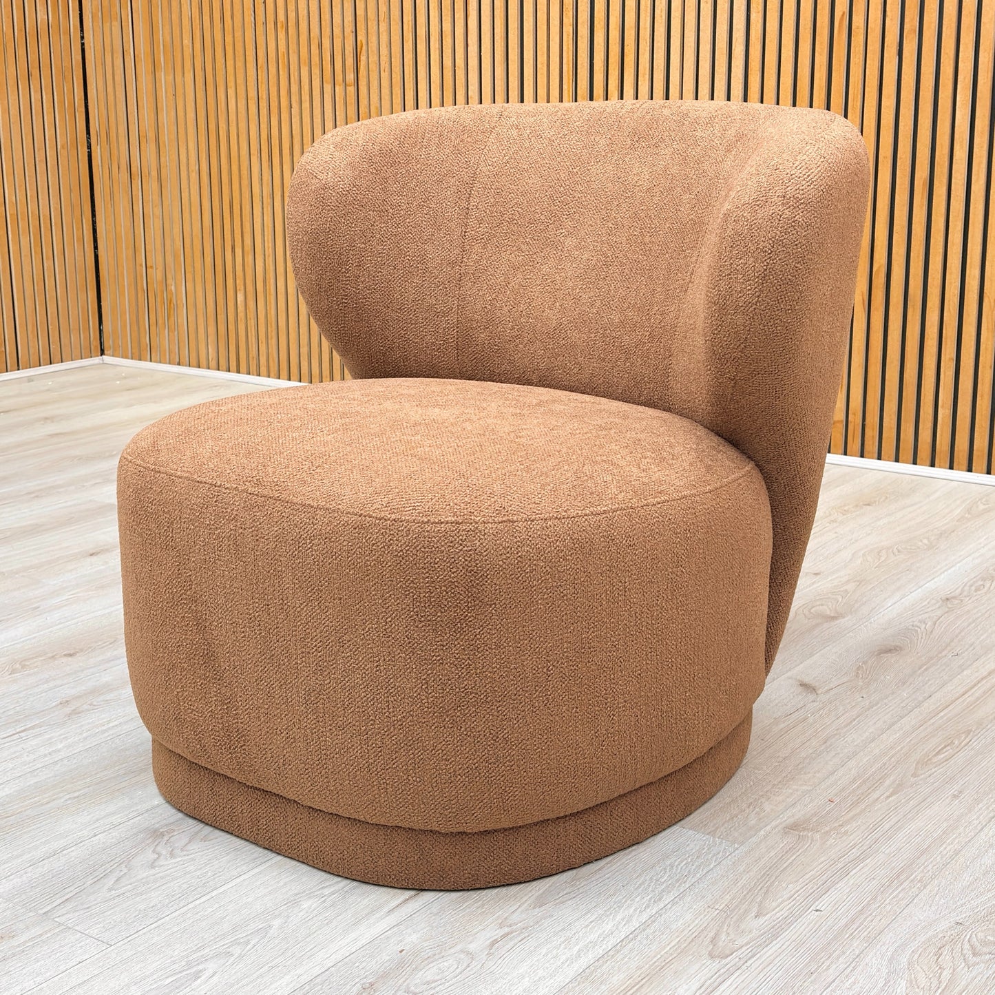 Lifestyle shot of the Knox accent chair in a room setting, showing its generous seating area and elegant upholstery texture.