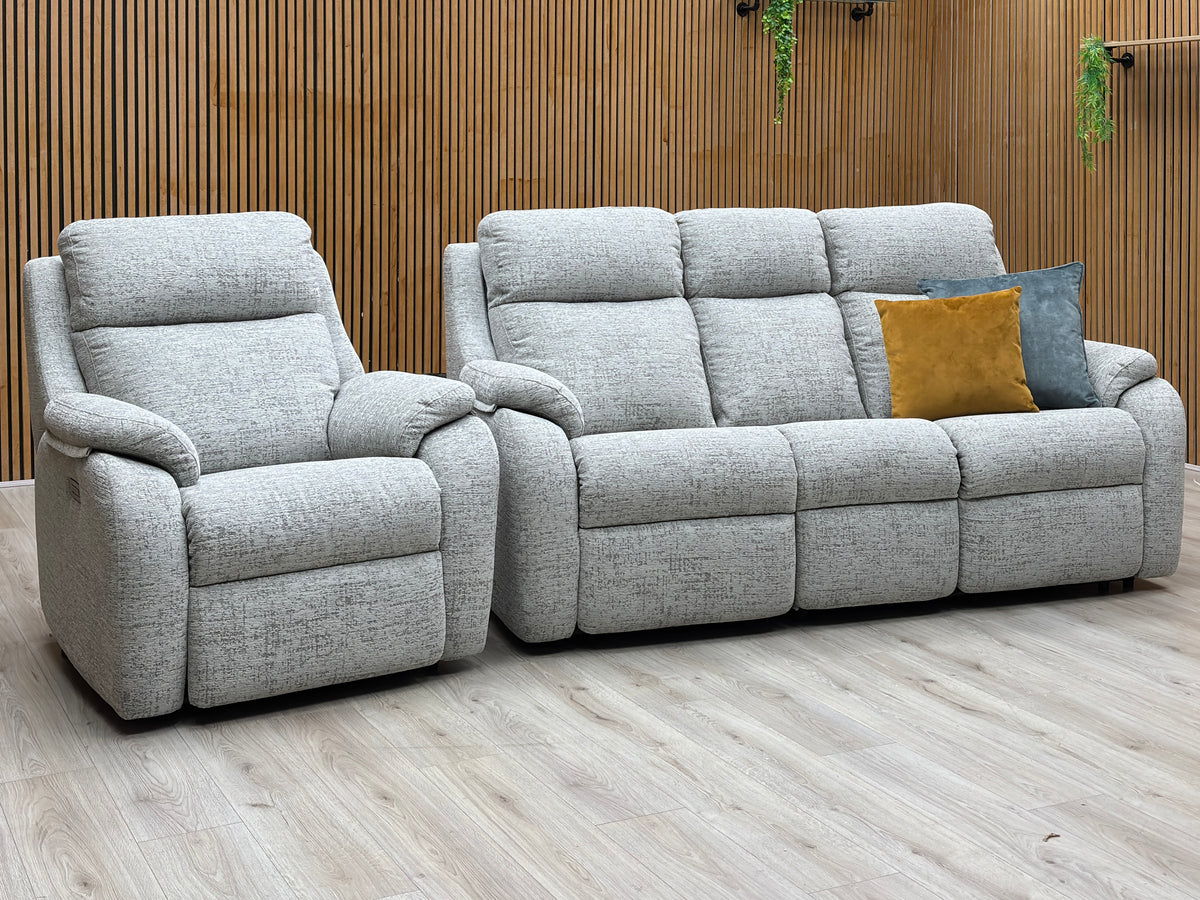 G Plan Kingsbury mist grey fabric sofa and power chair against a slatted wooden wall on a light oak floor
