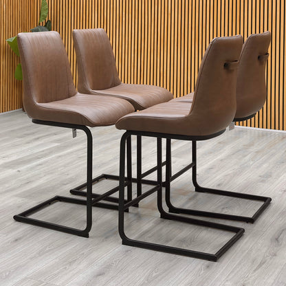 Bodahl Terra cognac brown faux leather cantilever bar stools against a slatted wooden wall