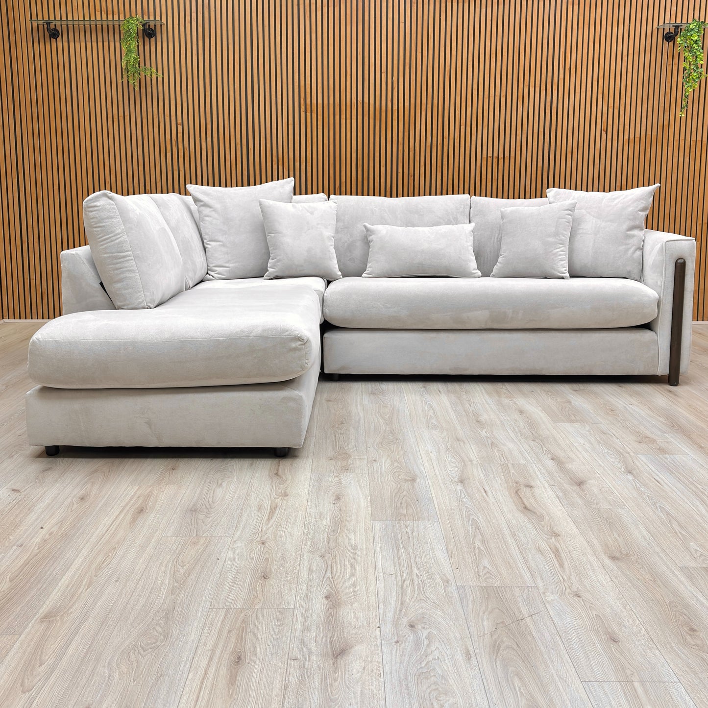 Front view showing the structured formal back design and deep cushions of the Barney left-hand facing sofa.