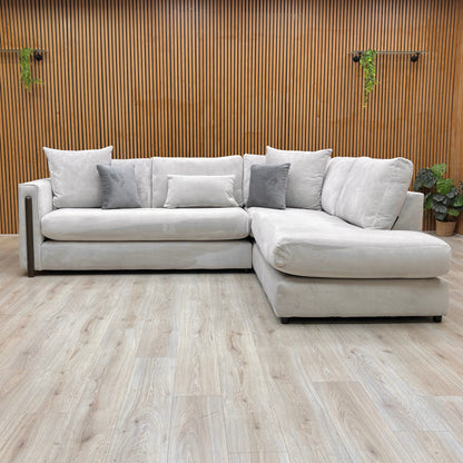Front view of the Barney corner sofa, showing the formal back design and deep, comfortable seat cushions.
