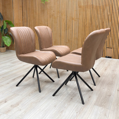 Lifestyle view of the ‘Terra’ swivel chair, emphasizing the plush deeply padded bucket seat and the rich, authentic character of the high-quality tan brown leather.