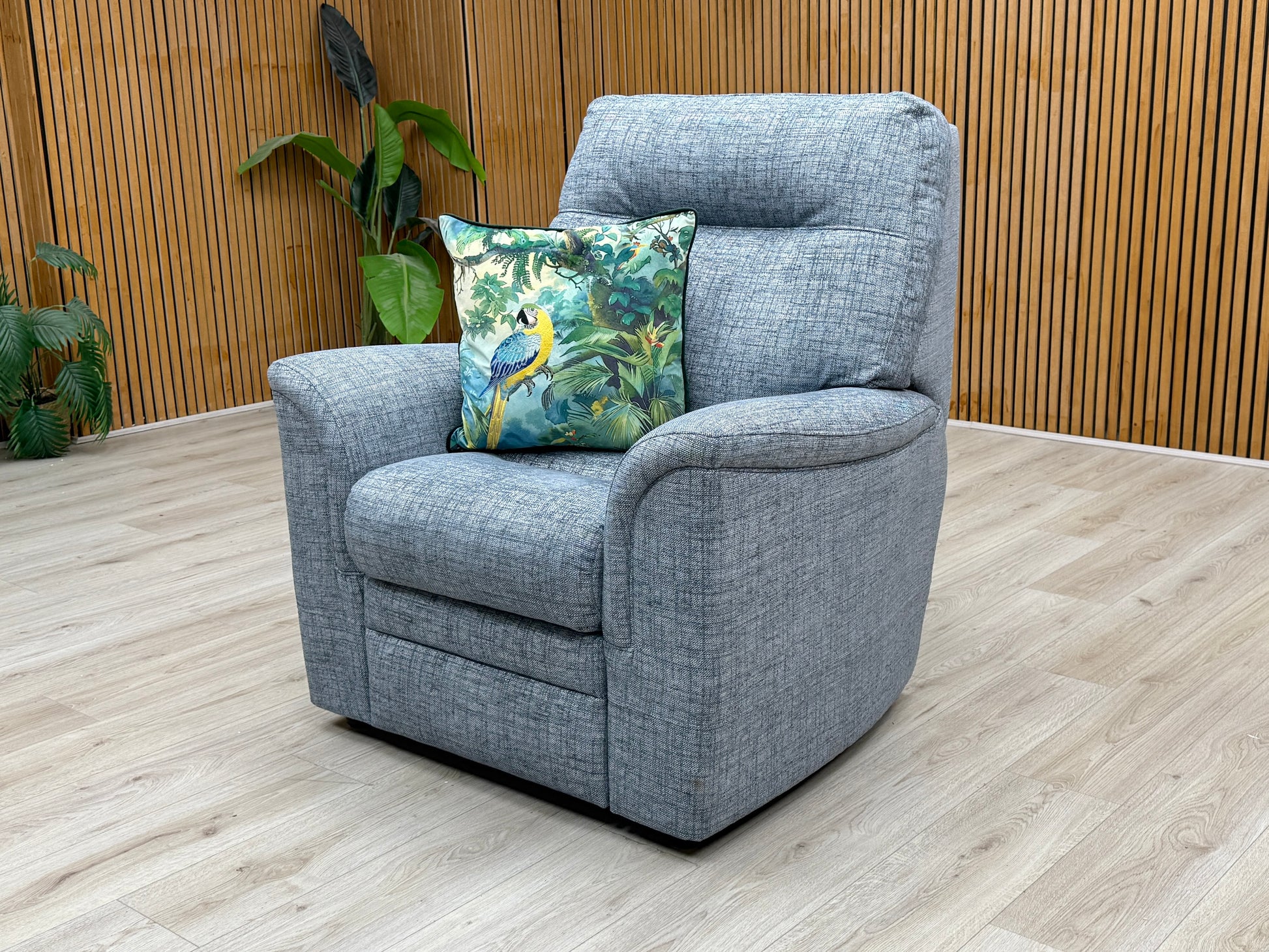 Lifestyle view of the ‘Hudson 23’ fabric chair, emphasizing the generous seat depth and the crisp, clean finish of the blue textured fabric.