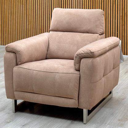 Moet sand beige velvet power recliner chair on chrome sled legs against a slatted wooden wall