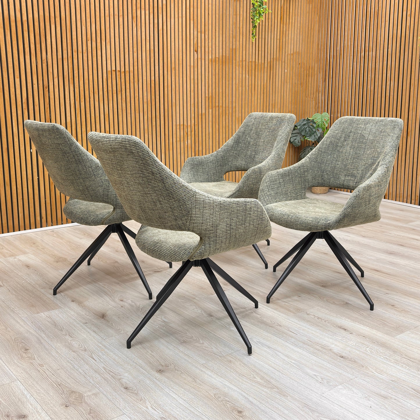 Lifestyle shot of the Sage Green Tweed Charlotte dining chair, showing its modern design.