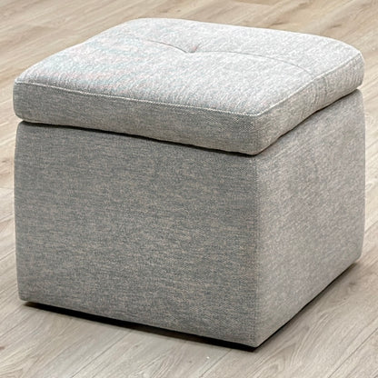 Easy Tray wild dove grey fabric storage footstool on a light oak floor, angled view