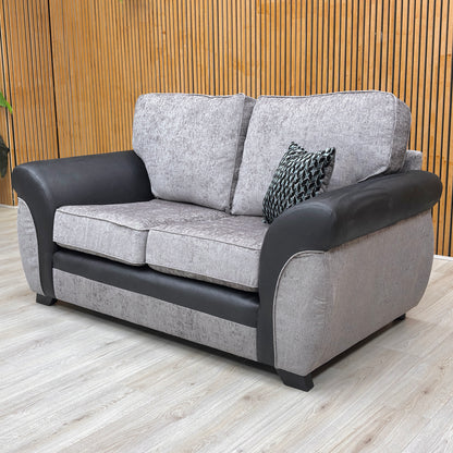 Lifestyle shot of the Marino’ grey sofa in a modern living room, showcasing its versatile style and comfortable proportions.