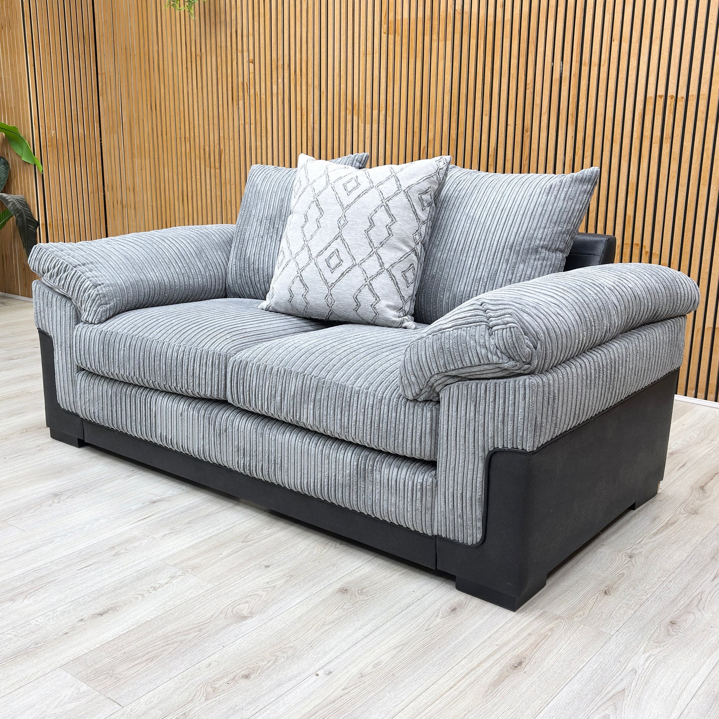 Lifestyle shot of the ‘Marissa’ 2 seater sofa in a compact living room setting, demonstrating its stylish and space-saving appeal.