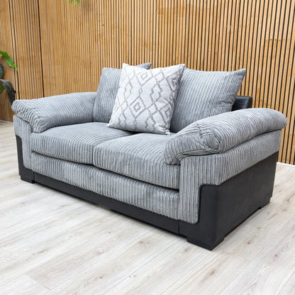 Lifestyle shot of the ‘Marissa’ 2 seater sofa in a compact living room setting, demonstrating its stylish and space-saving appeal.