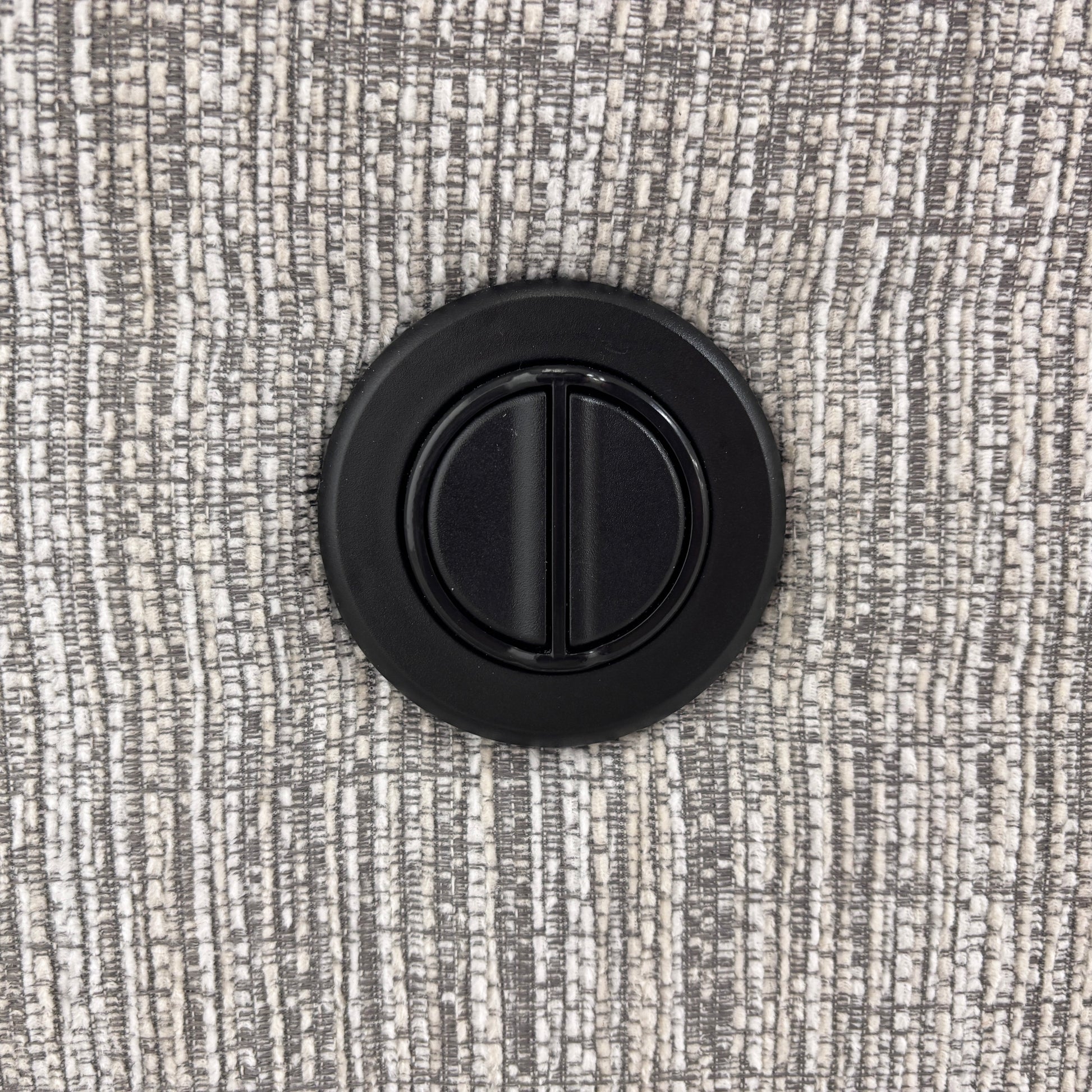 Detailed shot of the power control buttons located on the side of the sofa for easy access.