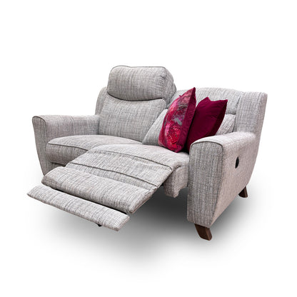 Side view of the sofa in a fully reclined position, showcasing the headrest and footrest extension.