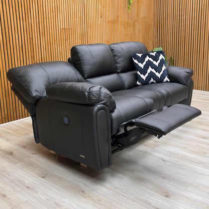 Lifestyle shot of the ‘Leighton’ 3 seater sofa in a contemporary lounge, showcasing its sleek black finish and comfortable seating.