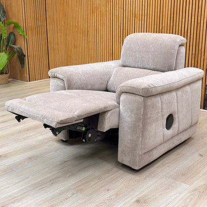 Lifestyle shot of the 'Genius' media chair in Nutmeg fabric, highlighting the integrated controls and speakers.