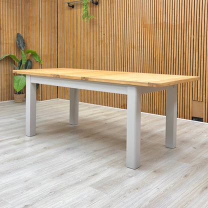 Lifestyle view of the ‘Lewis’ oak dining table, highlighting its clean lines and smooth surface.