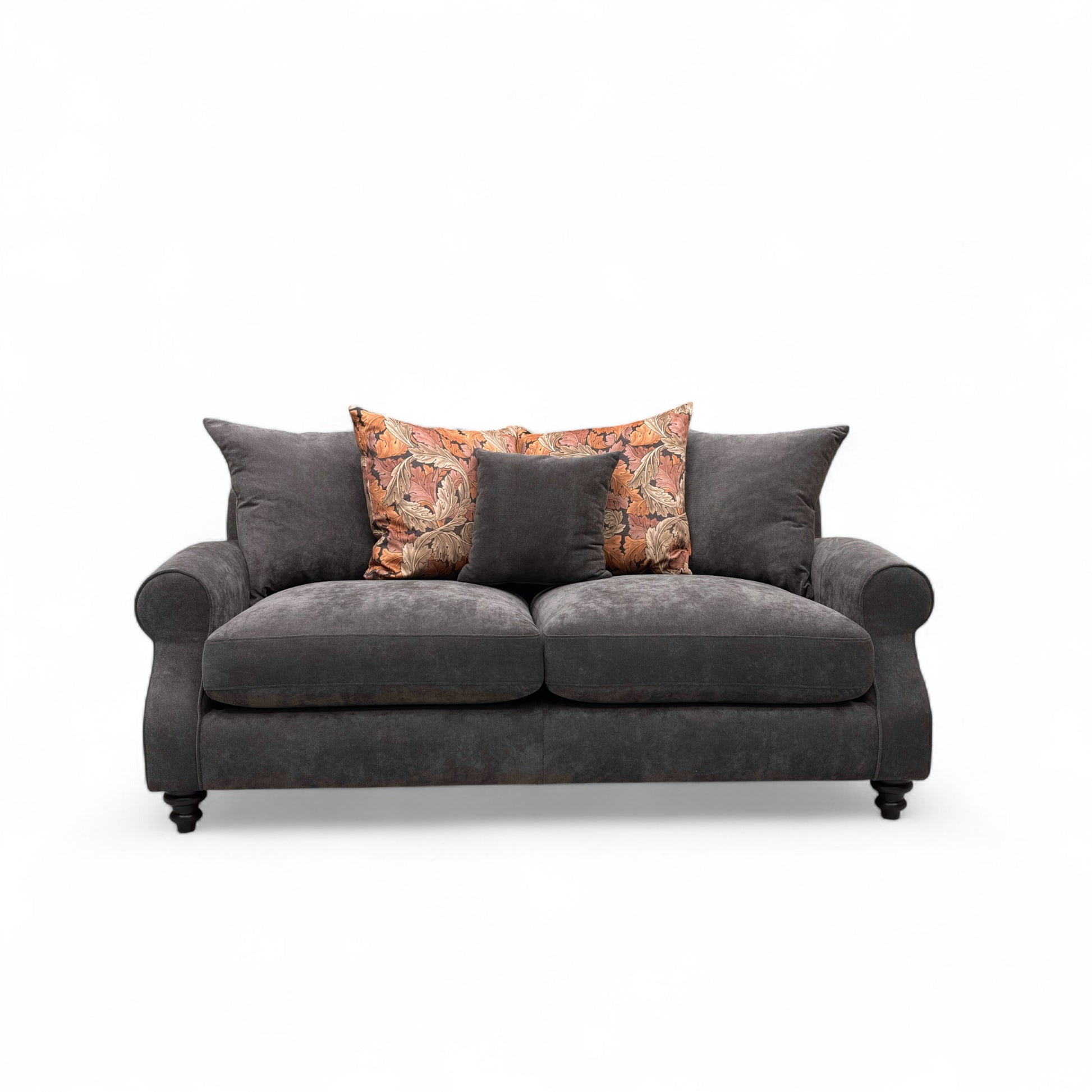 Gray sofa with decorative pillows on a white background