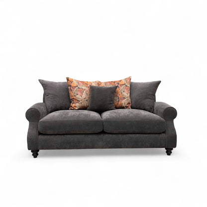Gray sofa with decorative pillows on a white background