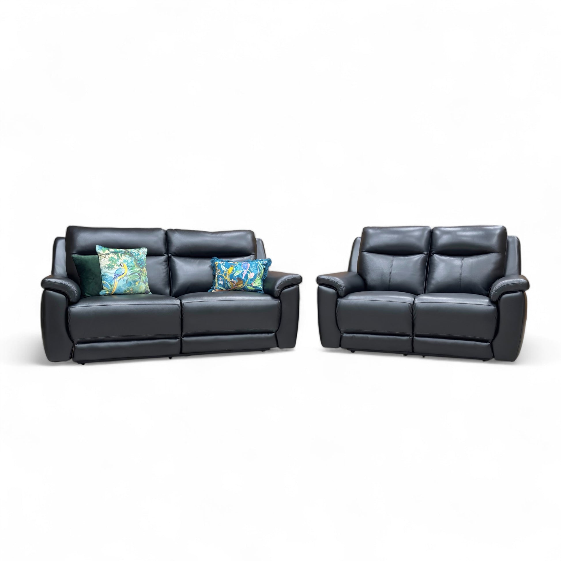 Black leather sofa set with two recliners on a white background
