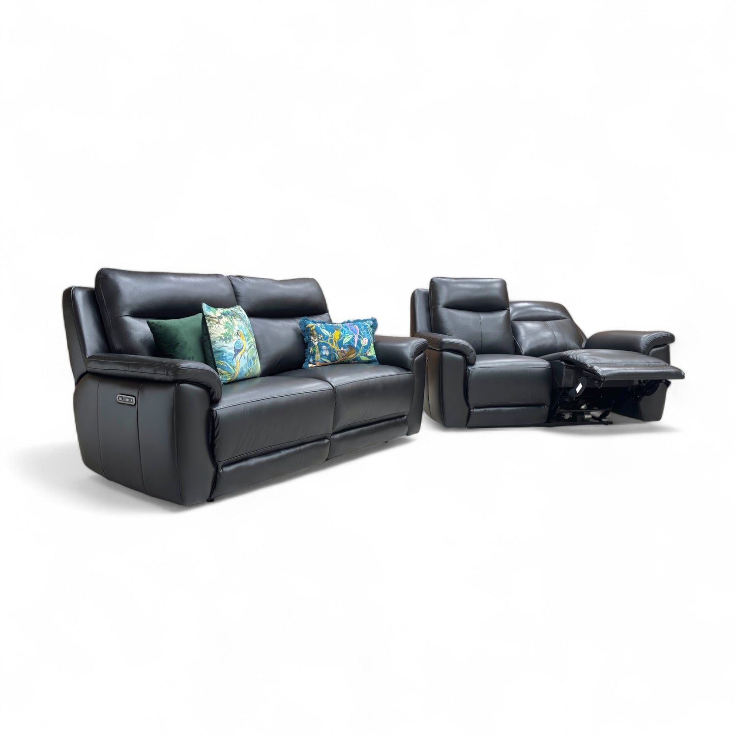 Black leather recliner sofa set with colorful cushions on a white background