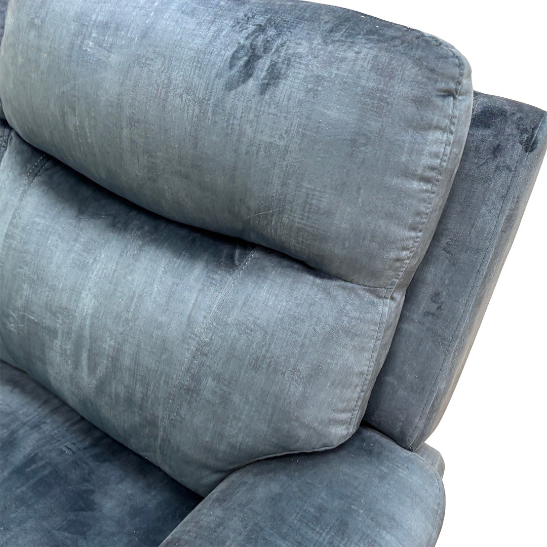 Detailed shot of the luxurious airforce blue velvet upholstery fabric and premium stitching.