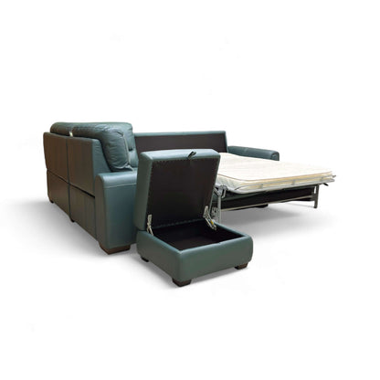 Green leather sofa with storage compartment and pull-out bed on a white background