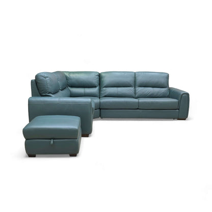 Green leather sectional sofa with ottoman on a white background