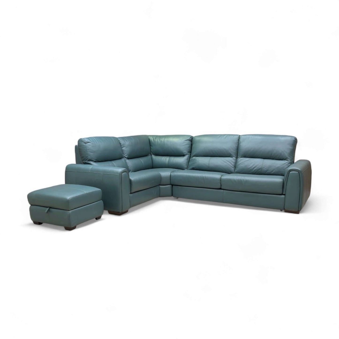 Green leather sectional sofa with ottoman on a white background