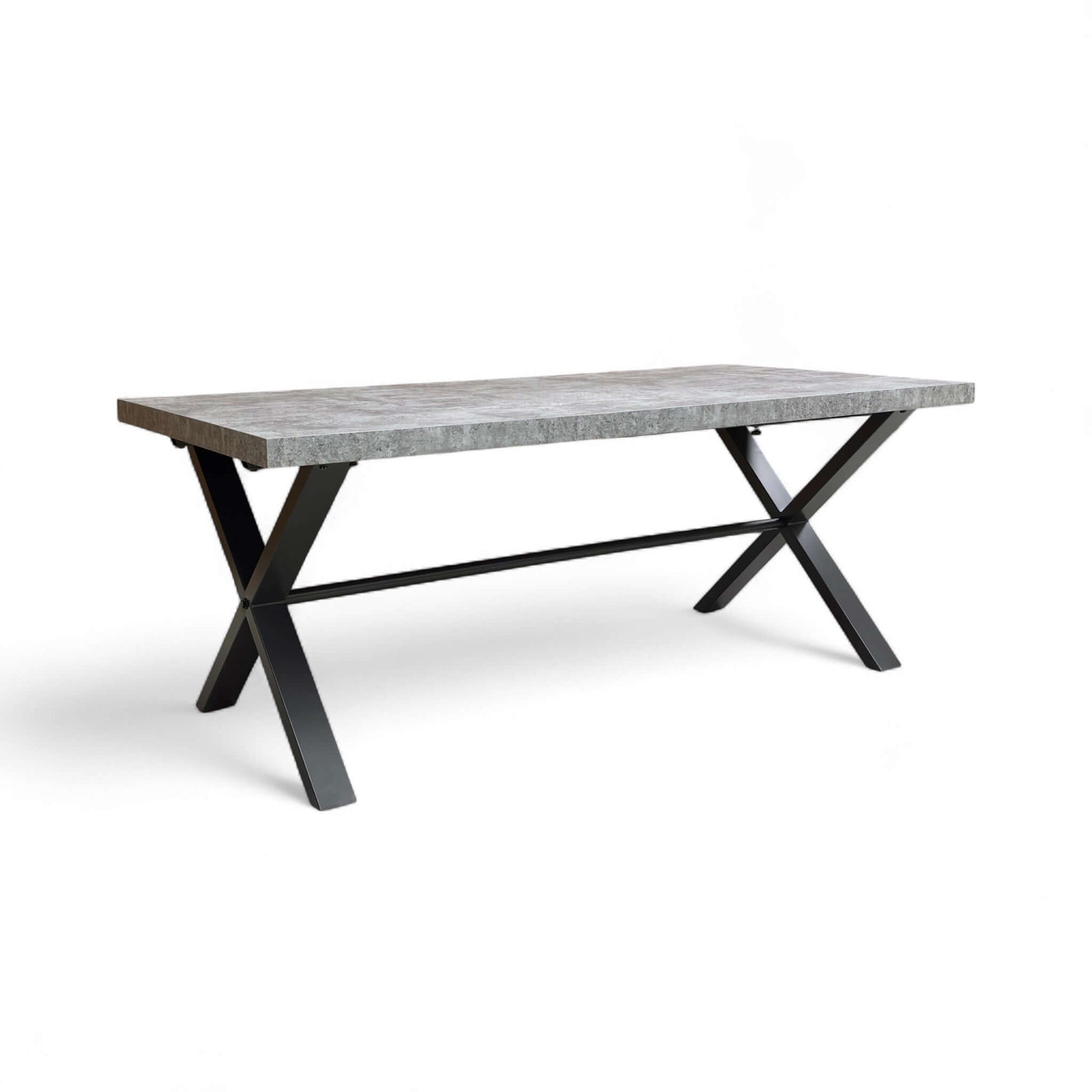 Dining table with concrete top and black metal legs on a white background