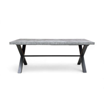 Dining table with marble top and black metal legs on a white background